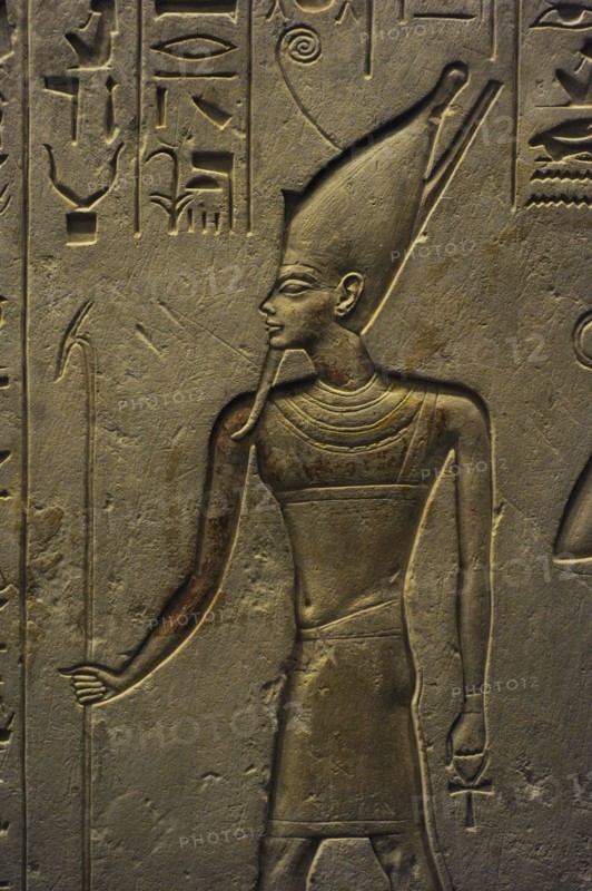 Stele of Haremheb adoring three gods.