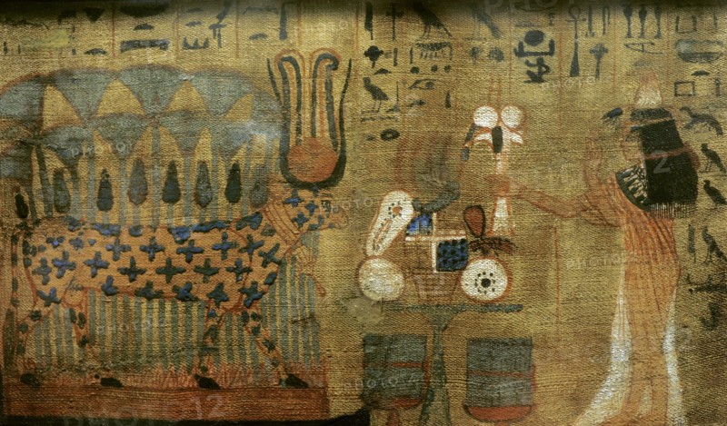 Woman making offerings to the goddess Hathor, cosmic divinity.