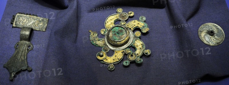 Solar cross brooch.