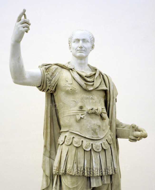 Figure in miliary uniform, with a modern head of Julius Caesar.
