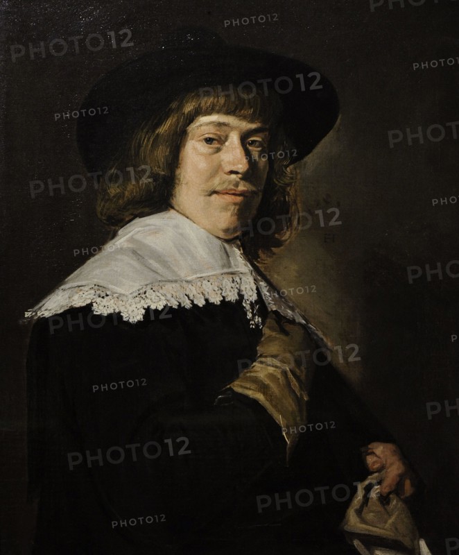 A Young Man Holding a Glove.