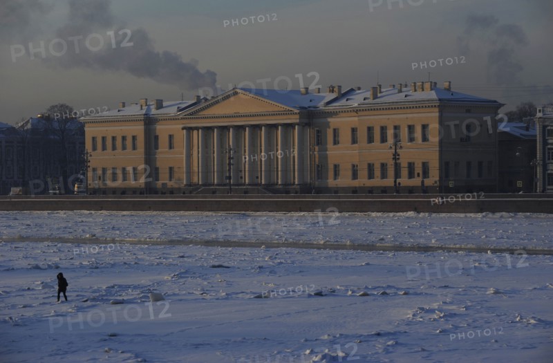 Person walking on the frozen Neva river during the winter surface.