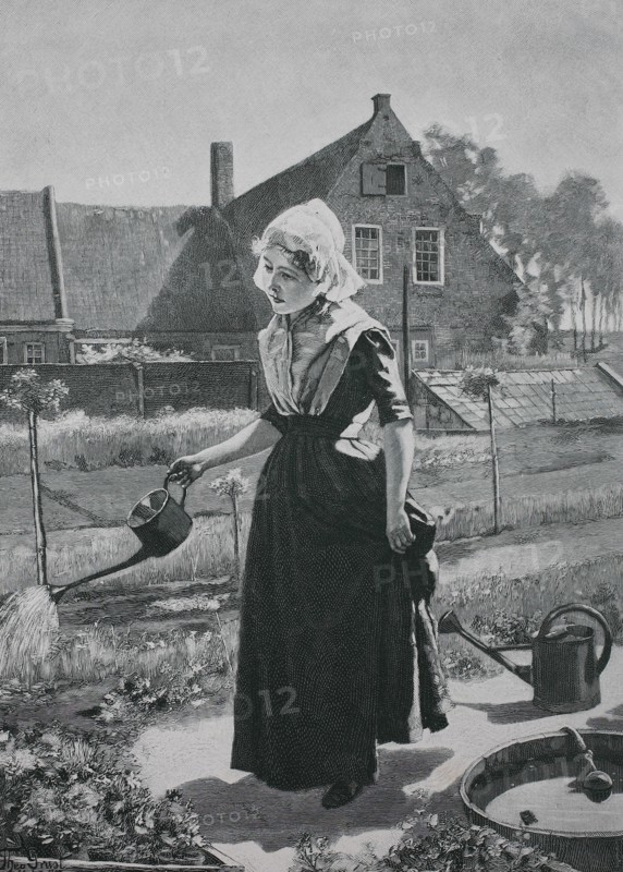Girl watering in the home garden