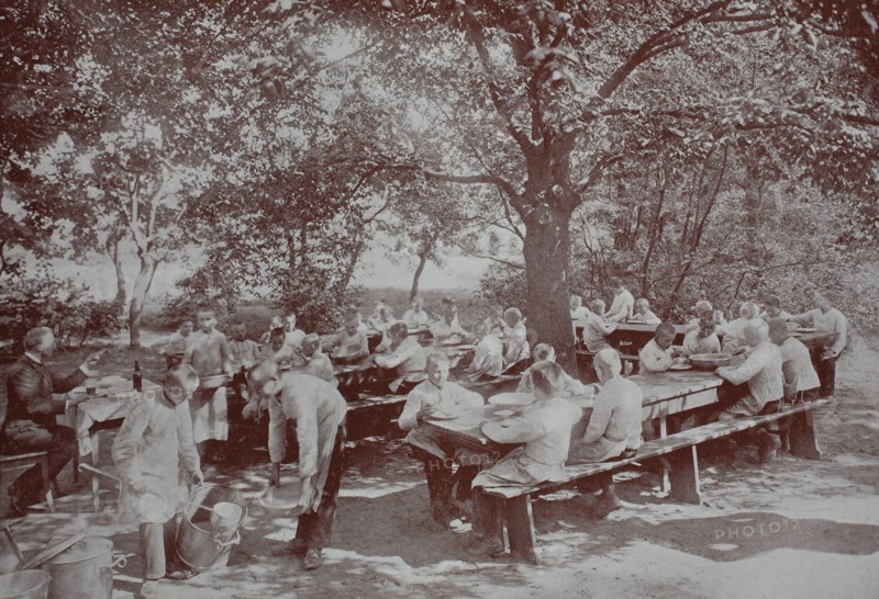 Orphans in Berlin having lunch in the garden