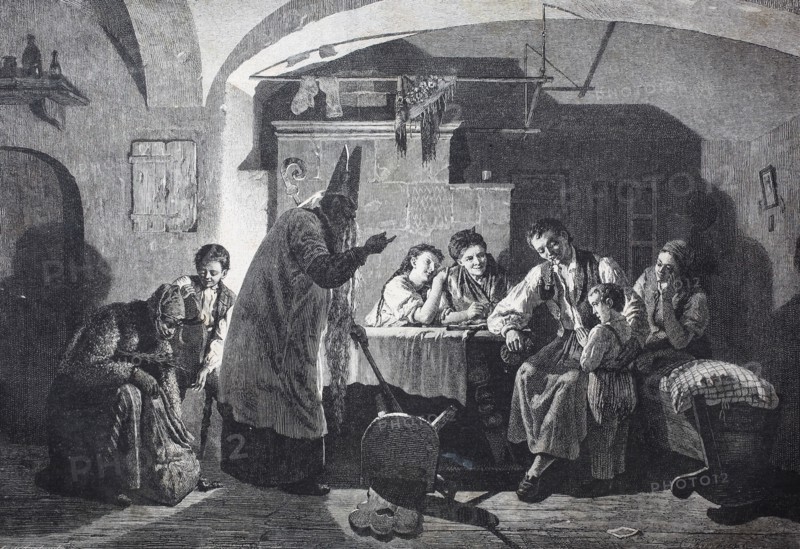 Saint Nicholas visits the family and asks the child if it was a good one and he can give nuts to him  /  Der heilige Nikolaus besucht die Familie und fragt das Kind