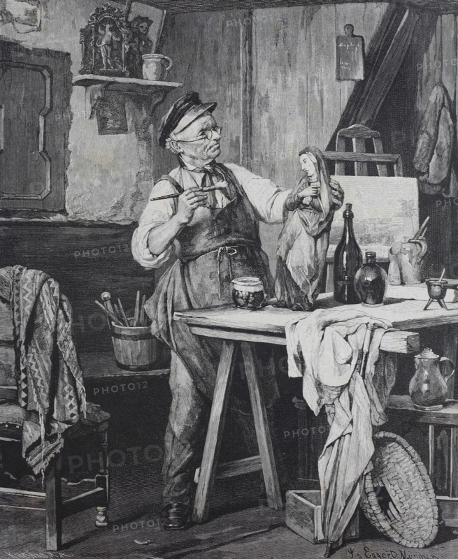 Artist paints a carved madonna in his workshop  /  Der Künstler malt eine geschnitzte Madonna in seiner Werkstatt