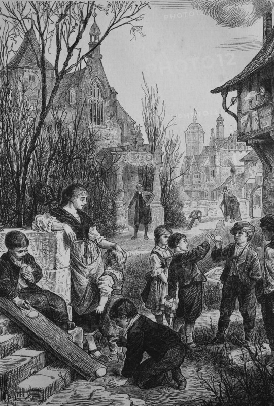 the children playing easter games with easter eggs  /  Die Kinder spielen Osterspiele mit Ostereiern