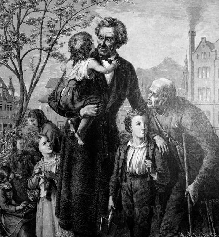 Father with children and an old man on the village square