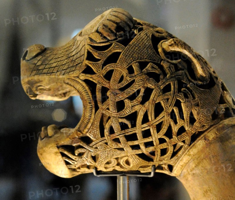 Animal-head post carved in wood