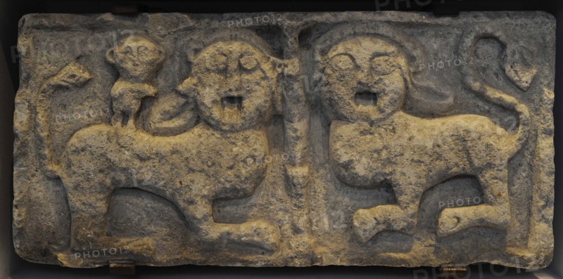 Relief. Pair of lions and a monkey.