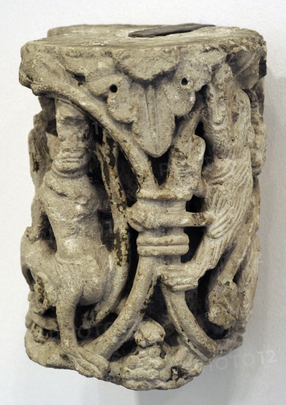 Vine ornament with centaur and bear.