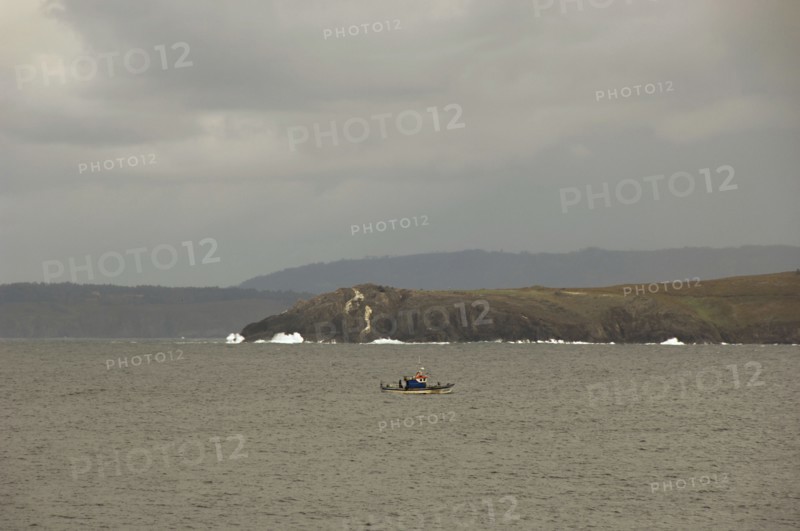 View of the Atlantic coast. Fishing boat.