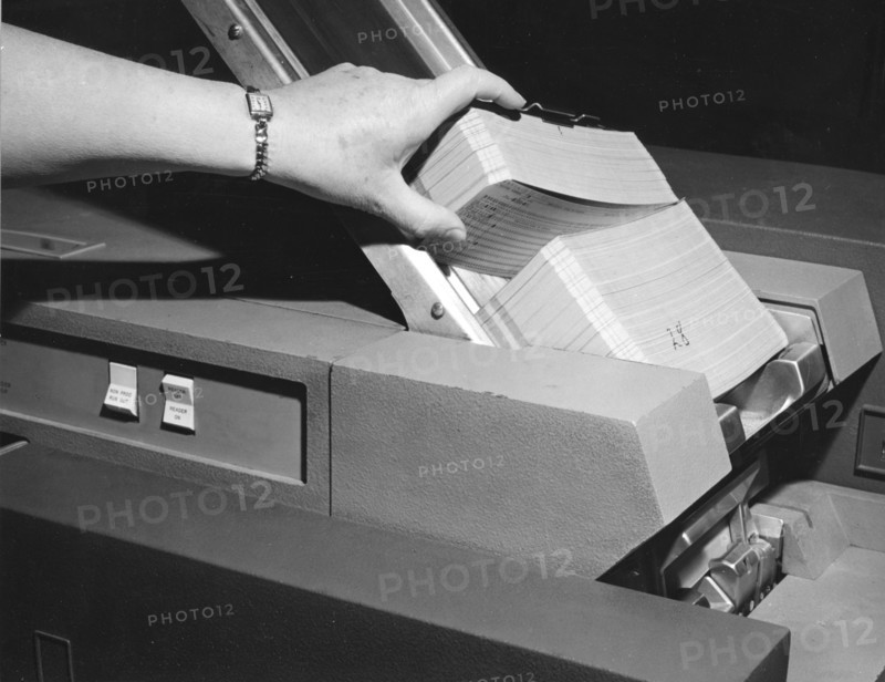 Punched Data Cards Fed Into Processor