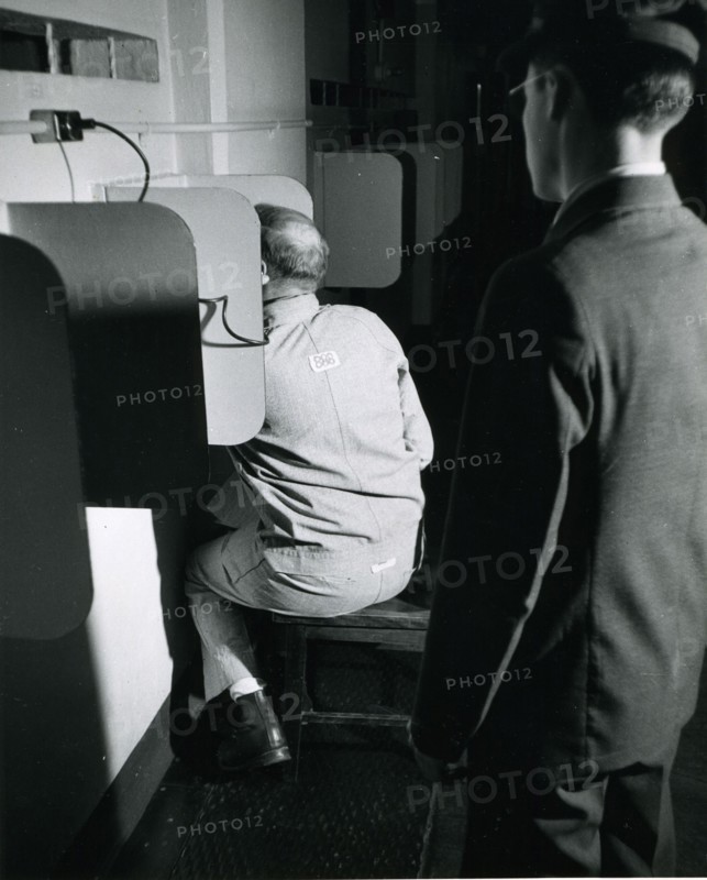 Alcatraz prisoner making a phone call. Alcatraz Prison, San Francisco, 1950's