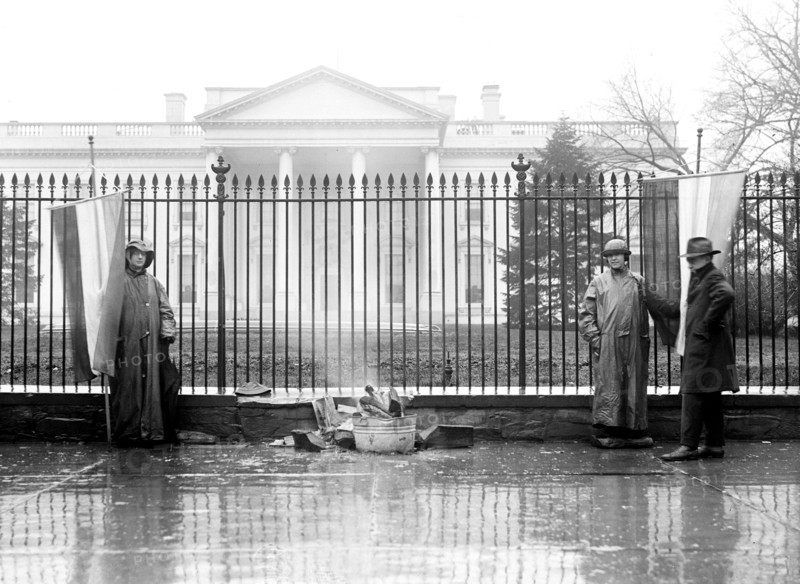 Woman Suffrage Movement - Bonfire on the sidewalk in front of the White House circa 1918 .