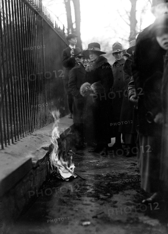 Woman Suffrage Movement - Bonfire on the sidewalk in front of the White House circa 1918 .