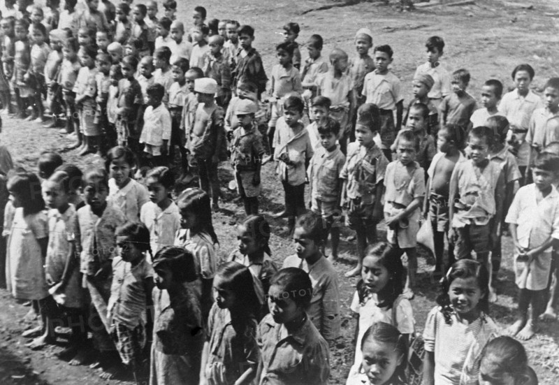 Ambarawa: The Dutch Indian school was festively opened on 20 September. The children listen to the teacher circa September 20, 1947 / Location Indonesia, Dutch East Indies.