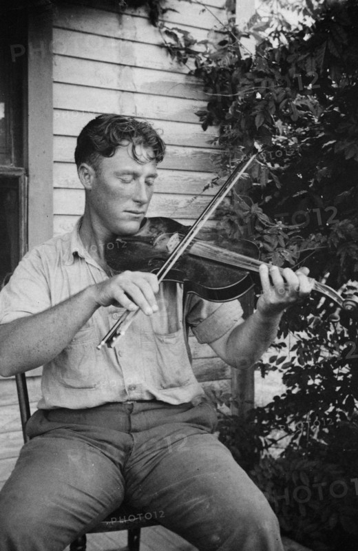 Wayne Perry playing fiddle, Crowley, Louisiana circa 1934-1950.