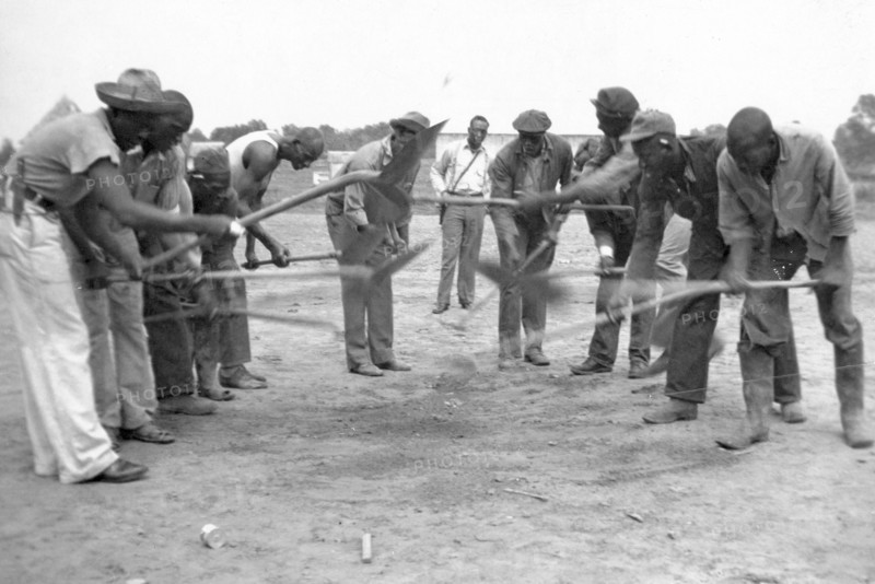 African American convicts working with shovels, possibly the singers of 'Rock Island Line' at Cummins State Farm, Gould, Arkansas, 1934.
