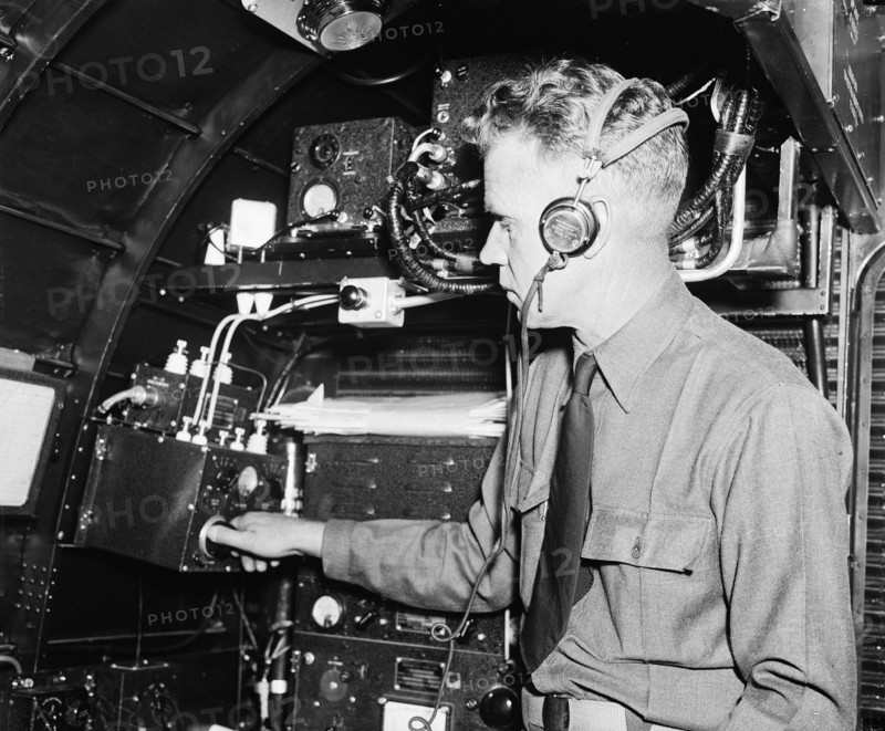 Part of flight crew of a passenger plane working on instruments circa 1936.
