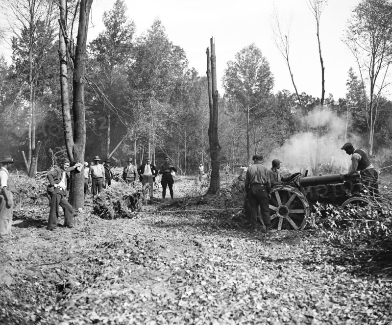 This crew of swampers is busy clearing out trees and stumps to make a place for the erection of a new town by the government, popularly termed 'Tugwelltown' a.k.a. Greenbelt Maryland circa October 15 1935.