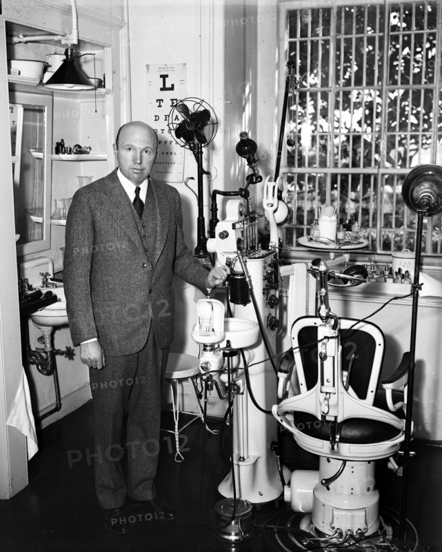 Dentist and dental office interior circa 1934.