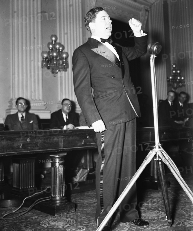 Senator Huey P. Long speaking in early 1935 .