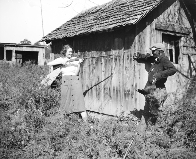 Edna Morris, who lives within a few hundred feet of the government-owned 'Tugwelltown' being constructed near Washington by Rehabilitation Administration, arms herself to protect her property against what she termed the 'thieving' of the workers on the project circa 10/15/1935.