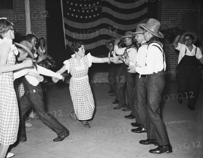 Men and women dancing (probably a square dance) circa 1934.