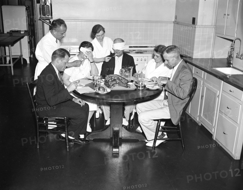 Blindfolded man and woman are part of a Meat testing experiment at the U.S. Department of Agriculture circa 1936.