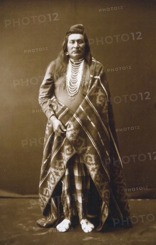 Edward S. Curtis Native American Indians - Full-length portrait of a Nez Percé man circa 1899.