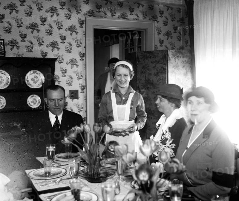 Mrs. Eleanor Roosevelt is a guest at a Girls Scouts 15 cent luncheon. On the left is Walter W. Head circa 1933.