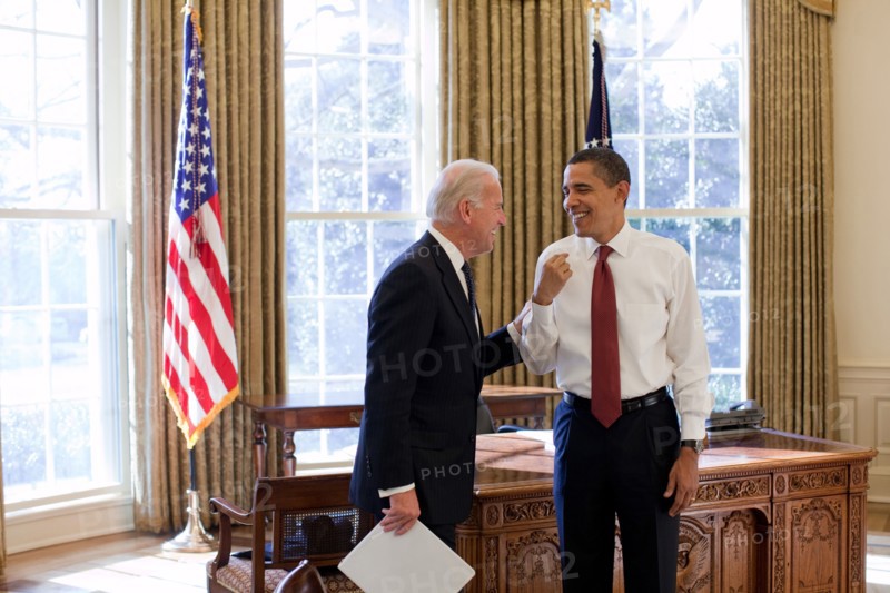 President Barack Obama and Vice President Joe Biden laugh together in the Oval Office, 1/22/09. .