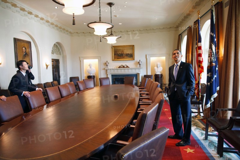 President Barack Obama surveys the Cabinet room with family members while touring the White House on his first day in office. 1/21/09.