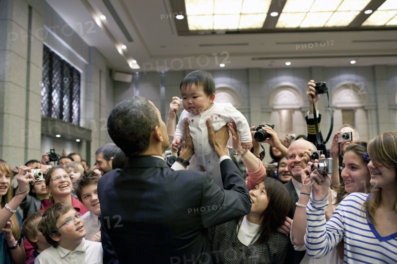 President Barack Obama greets the daughter of a U.S. embassy staff member at the Hotel Okura in Tokyo, Japan, Nov. 14, 2009.  .
