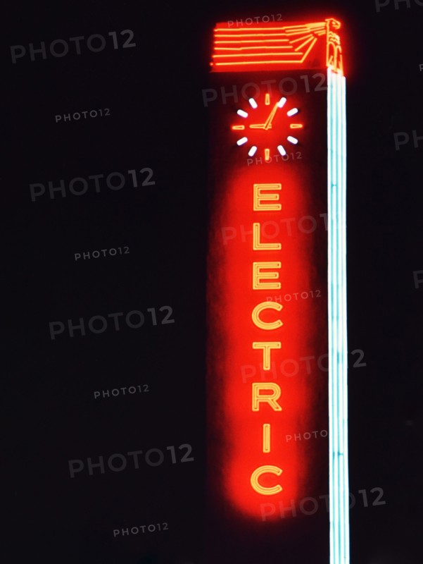 1956 Dallas - Neon sign featuring the word 'Electric' with a clock on top .