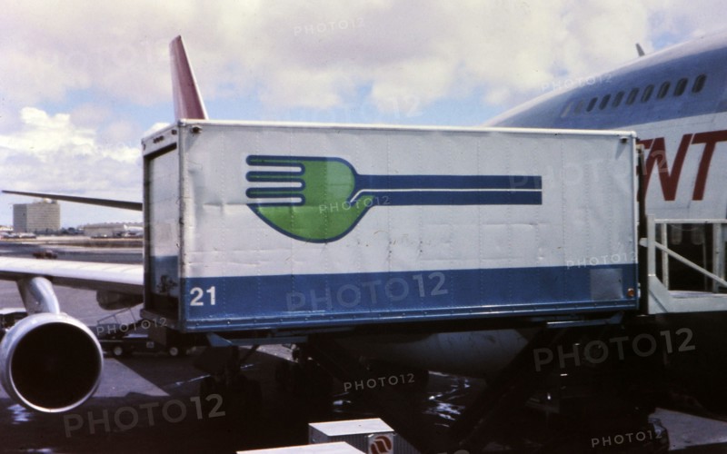 Skychef crew loading a Northwest Orient Airlines plane circa 1976.