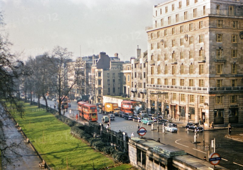 1961 London - Green Park Underground Station, double decker busses, city traffic.