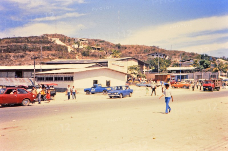 (R) Pedestrians at market in a Honduras village circa 1987.