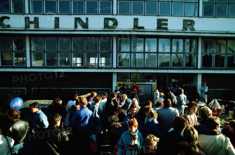 A crowd of East German refugees gathers outside the refugee center in West Berlin..