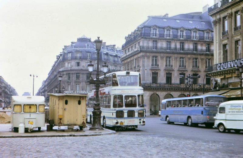 1972 France - (R) - Credit Lyonnais Bank and buses on road in Paris France.