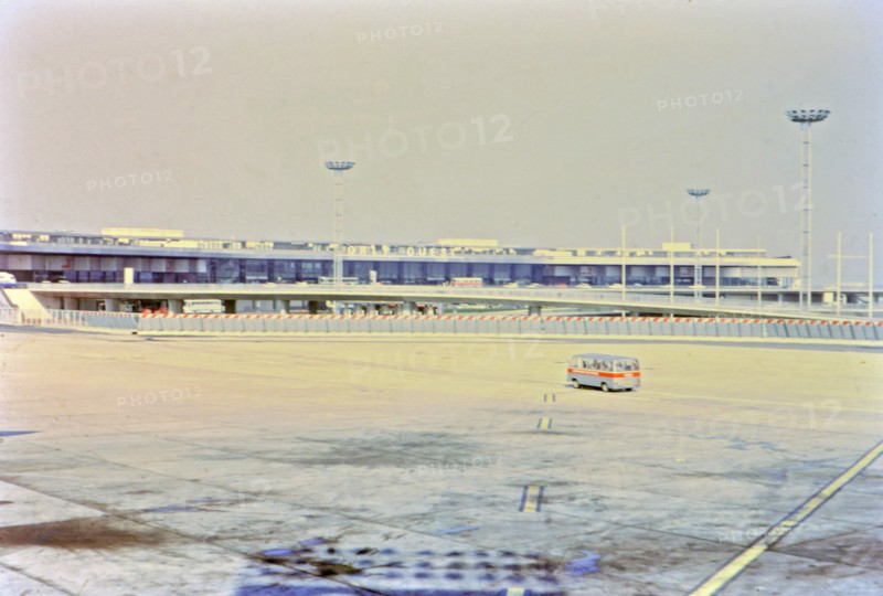 1972 France - (R) - A van driving across the tarmac at Orly Airport in Paris.