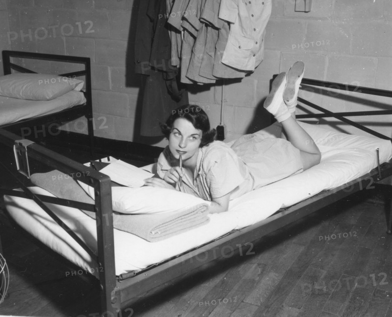 Female Marine writes letter in the barracks