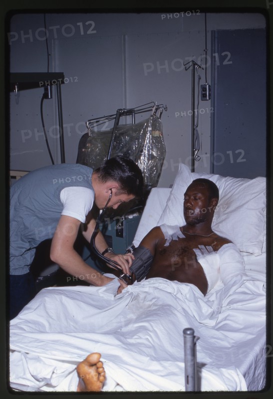 Corpsman Treats Wounded Marine
