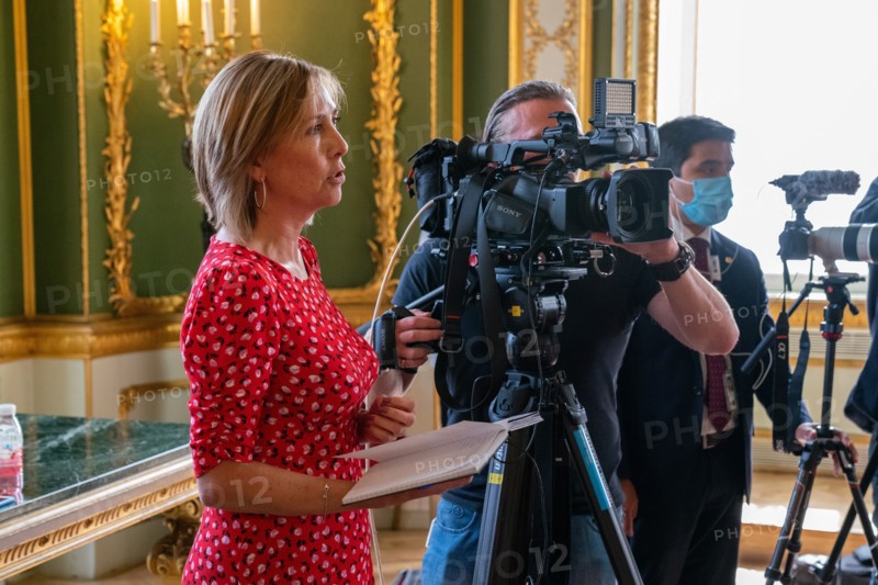 A reporter asks a question