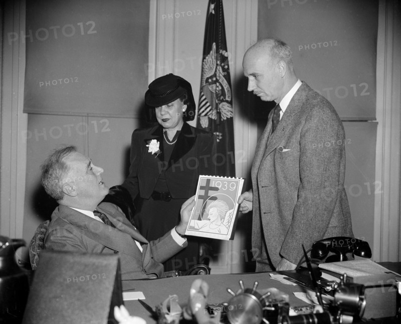 President Franklin Roosevelt buys his annual supply of Christmas Seals from Rockwell Kent