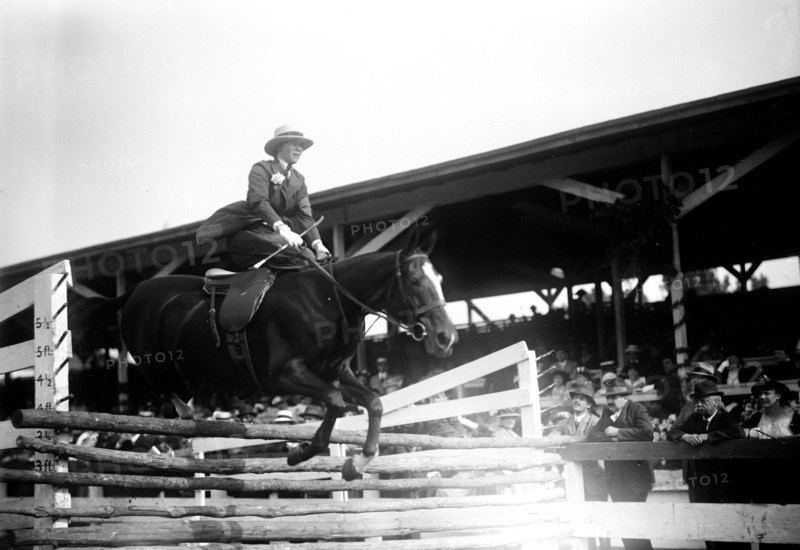 Miss Helen Buchanan horse jumping over rails