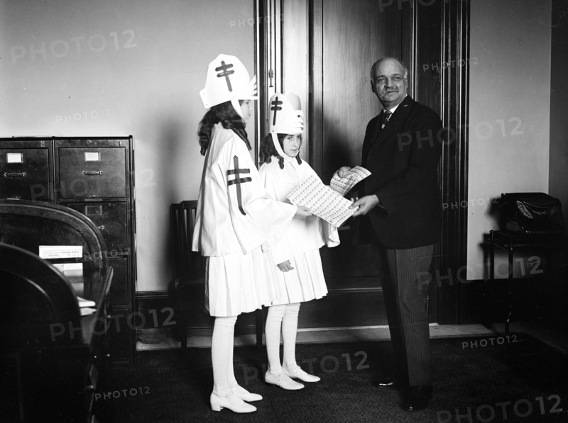 1928 - Vice President-elect Curtis receives supply of Christmas seals.