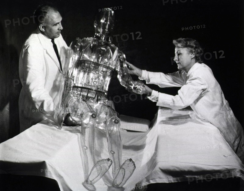Woman working with dummy patient model.