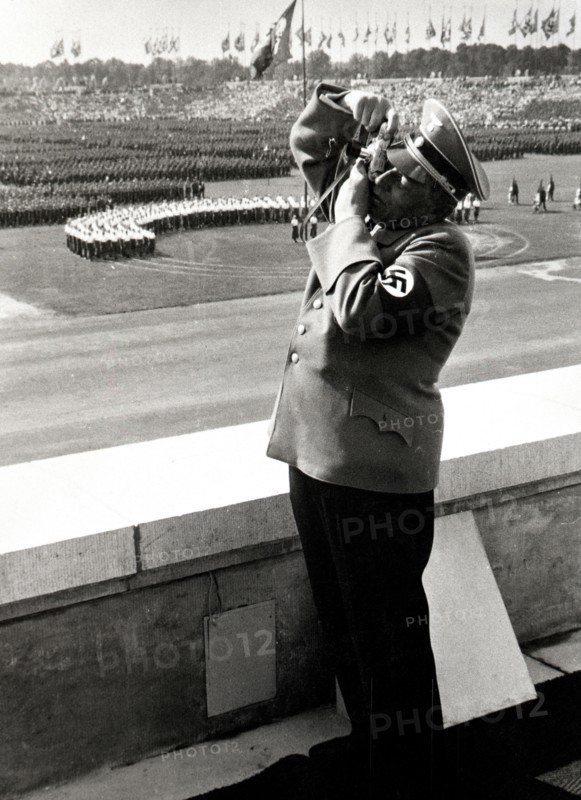 Nazi soldier with camera taking a photograph